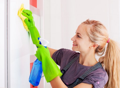 Carpet cleaning technician preparing professional cleaning equipment